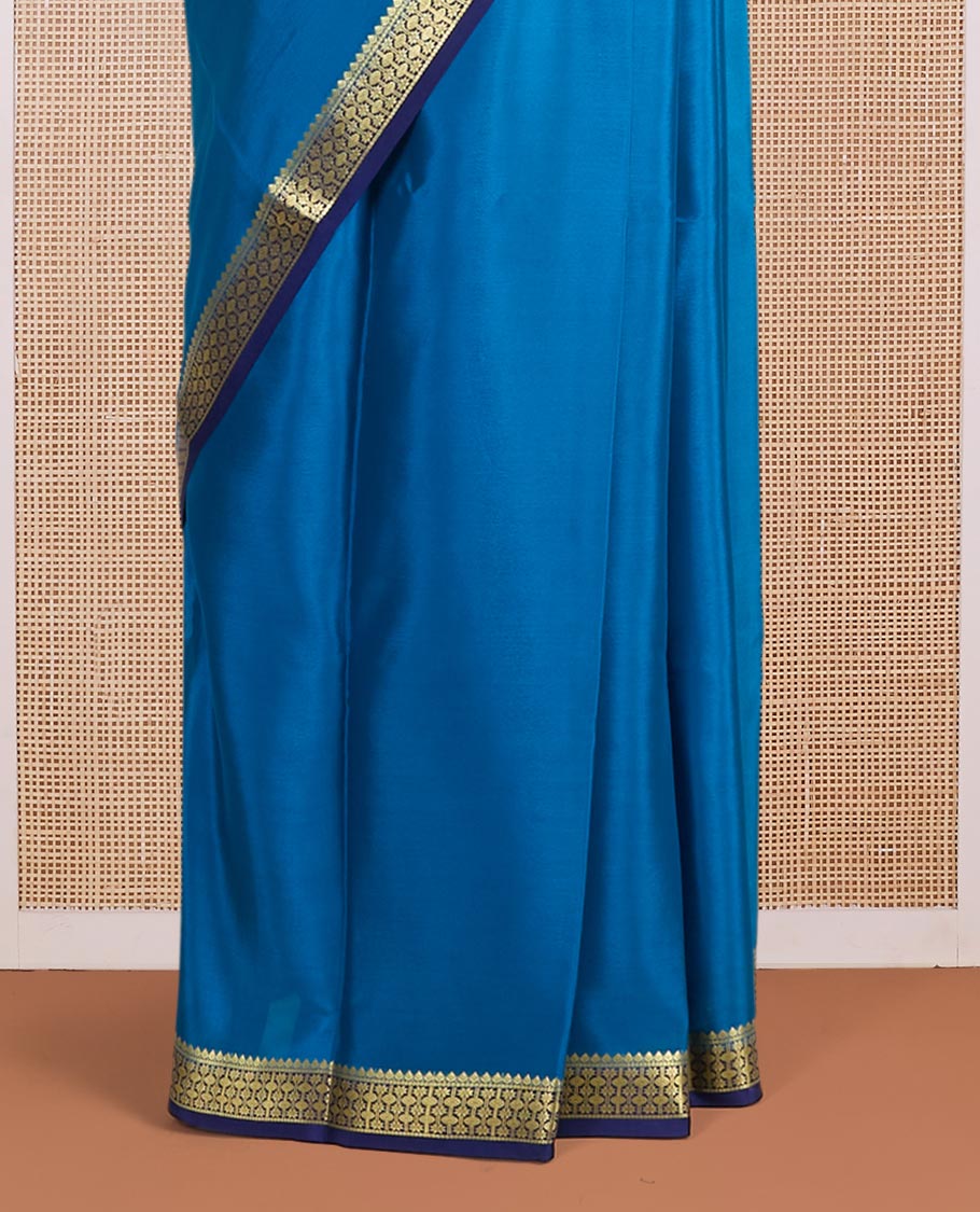 Blue plain Mysore silk saree, contrast golden zari border woven in traditional motifs & zari striped pallu