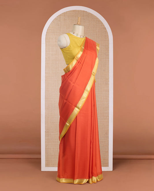 Kesari orange full-plain Mysore silk saree, contrast paisley zari design border & pallu of zari stripes
