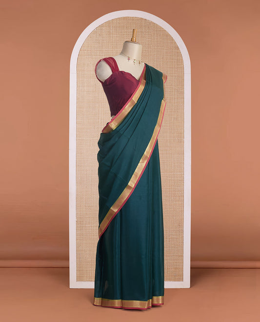 Deep forest green full-plain Mysore silk saree, contrast traditional zari design border & pallu of zari stripes
