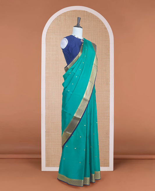Green zari buttas Mysore silk saree with contrast zari borders of jaal design and pallu of floral jaal design