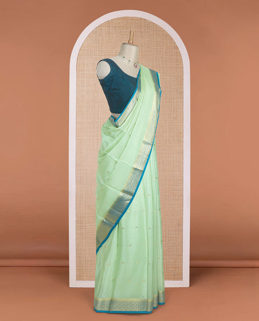 Pista green zari buttas woven Mysore silk saree, contrast jaal design zari border, and pallu adorned with jaal zari design weave