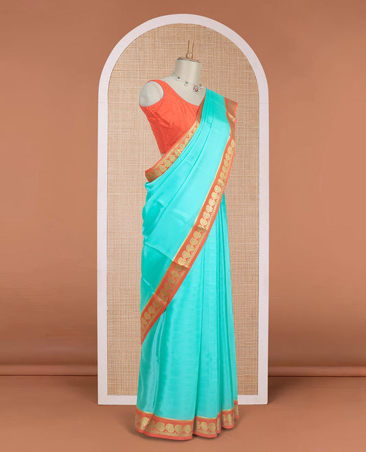 Blue plain design mysore silk saree, contrast paisley design zari border, and zari seer striped pallu