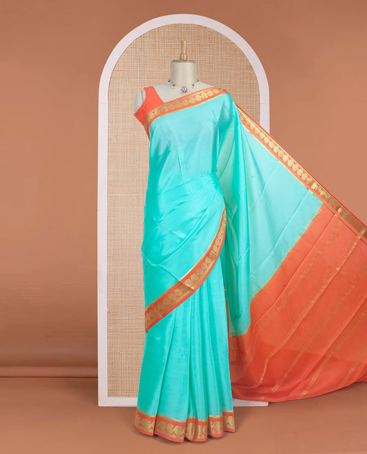 Blue plain design mysore silk saree, contrast paisley design zari border, and zari seer striped pallu