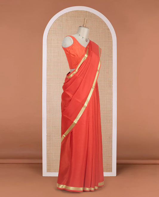 Orange plain design Mysore silk saree with traditional zari piping border, and zari striped pallu
