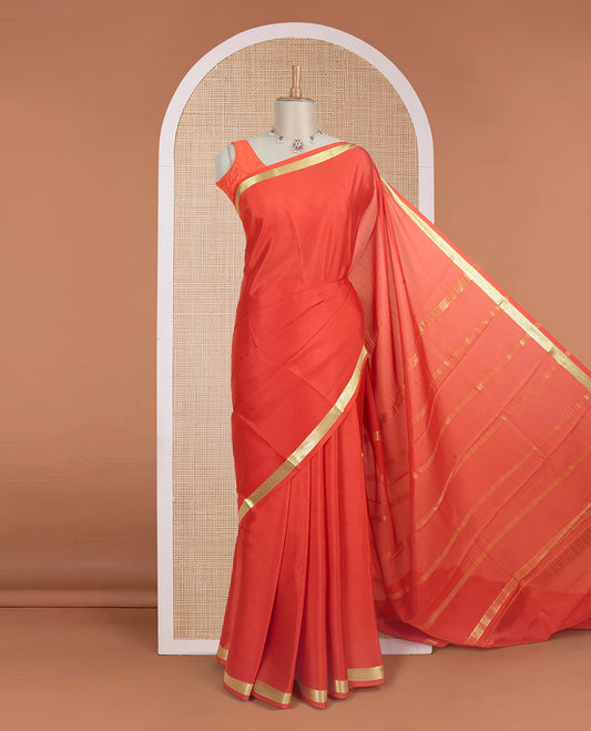 Orange plain design Mysore silk saree with traditional zari piping border, and zari striped pallu