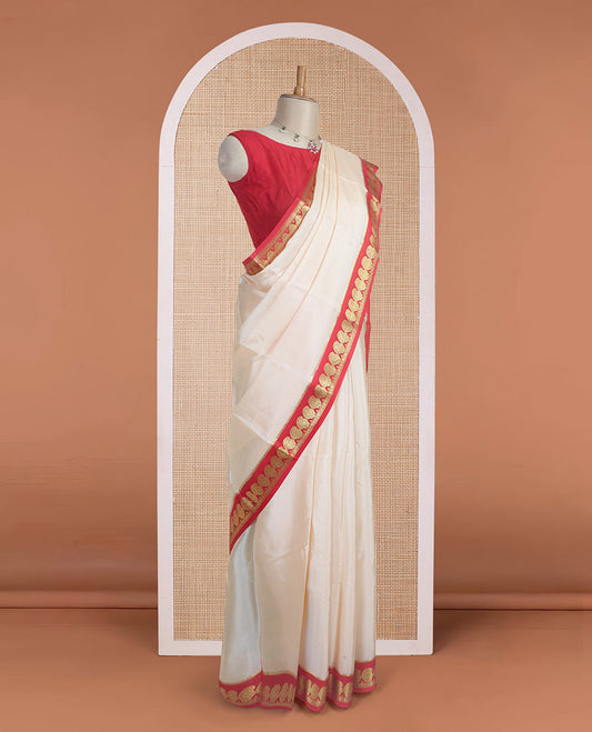 Cream plain design mysore silk saree, contrast paisley design zari border, and zari seer striped pallu