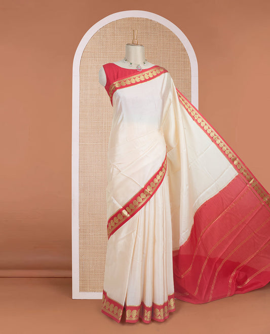 Cream plain design mysore silk saree, contrast paisley design zari border, and zari seer striped pallu