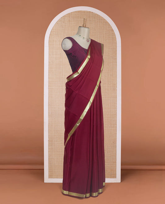 Maroon plain design Mysore silk saree with traditional zari design borders, and zari striped pallu