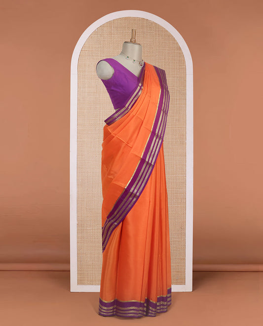 Kesari orange plain design Mysore silk saree with contrast rettai pettu borders of zari designs, and zari striped pallu