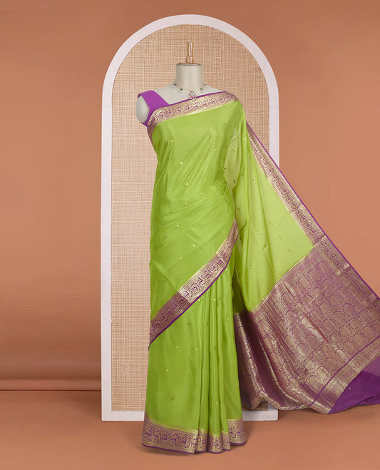 Parrot green zari buttas Mysore silk saree, contrast traditional zari border adorned with floral creeper design, and floral jaal pallu