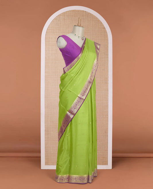 Parrot green zari buttas Mysore silk saree, contrast traditional zari border adorned with floral creeper design, and floral jaal pallu