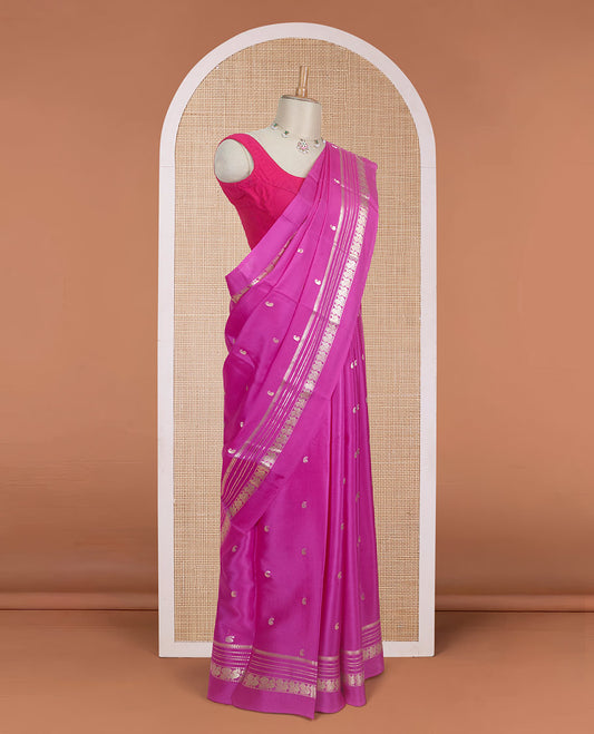 Rani pink paisley buttas Mysore silk saree, traditional zari border of peacock designs, and pallu steeped with paisleys