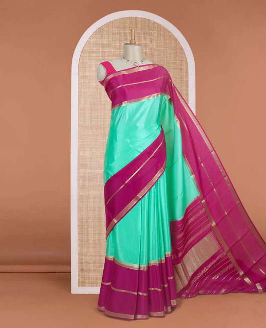 Turquoise plain design Mysore silk saree, contrast rettai pettu borders of zari designs, and pallu of zari stripes & temple design