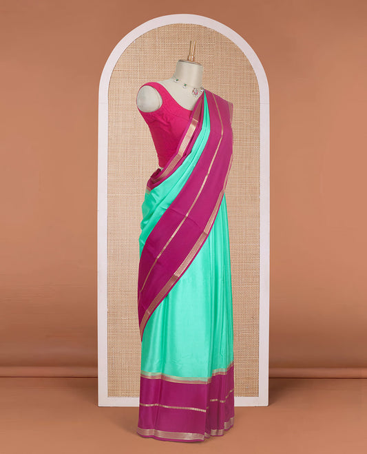 Turquoise plain design Mysore silk saree, contrast rettai pettu borders of zari designs, and pallu of zari stripes & temple design