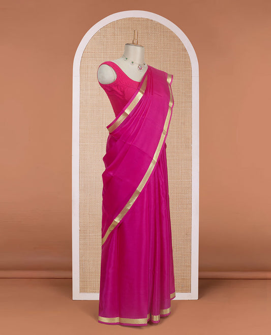 Dark rani pink plain design Mysore silk saree with traditional zari design borders, and zari striped pallu