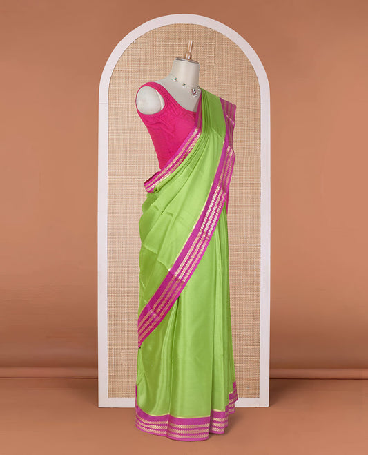 Parrot green plain design Mysore silk saree with contrast rettai pettu borders of zari designs, and zari striped pallu