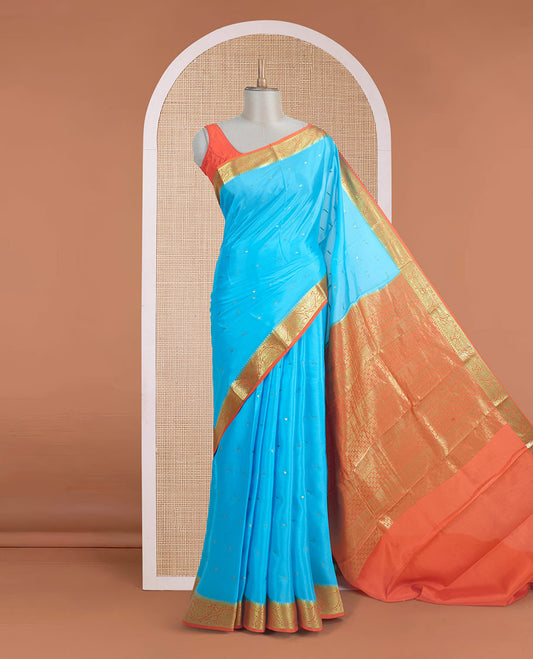 Sky blue zari buttas Mysore silk saree, contrast leaf creeper zari border, and floral zari design palllu