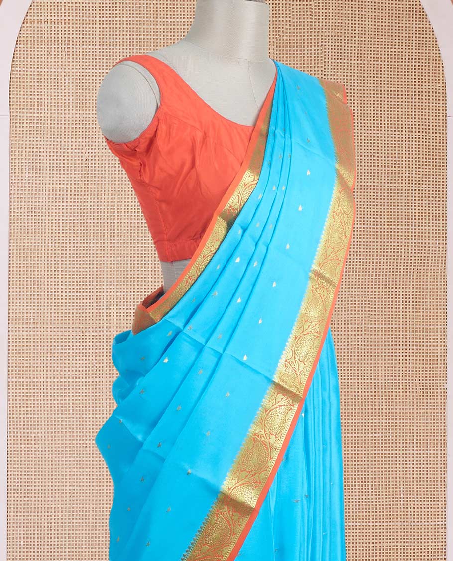Sky blue zari buttas Mysore silk saree, contrast leaf creeper zari border, and floral zari design palllu