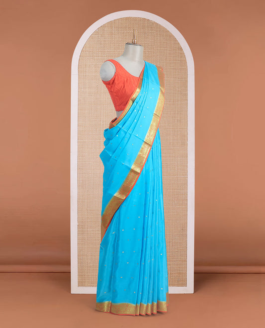 Sky blue zari buttas Mysore silk saree, contrast leaf creeper zari border, and floral zari design palllu
