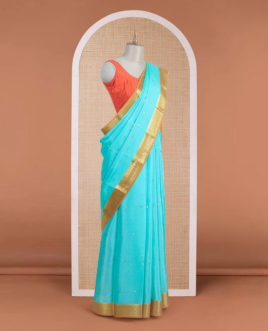 Powder blue zari buttas Mysore silk saree, contrast floral zari border, and zari design palllu