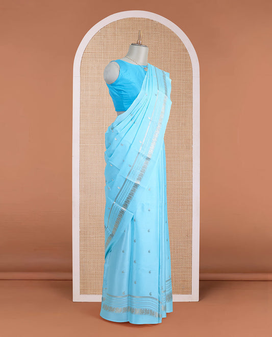 Powder blue manga zari buttas Mysore silk saree, rettai pettu border of peacocks, and pallu steeped with manga motifs