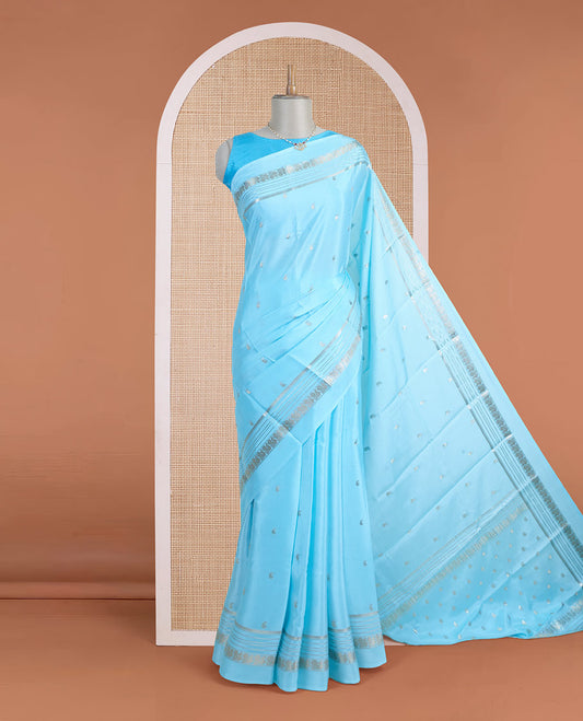 Powder blue manga zari buttas Mysore silk saree, rettai pettu border of peacocks, and pallu steeped with manga motifs
