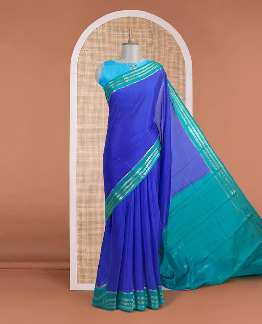 Blue plain design Mysore silk saree, contrast traditional rettai pettu border, and zari stripes pallu