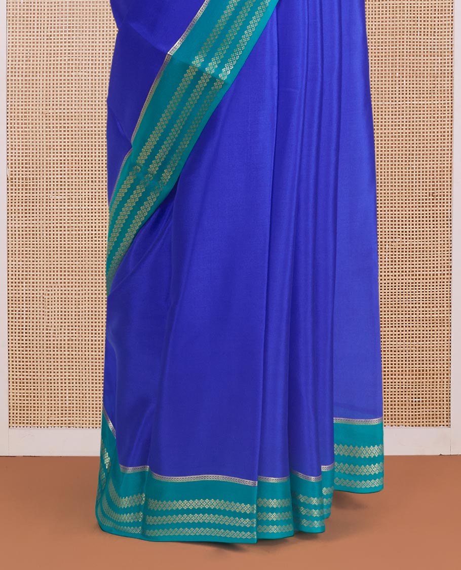 Blue plain design Mysore silk saree, contrast traditional rettai pettu border, and zari stripes pallu