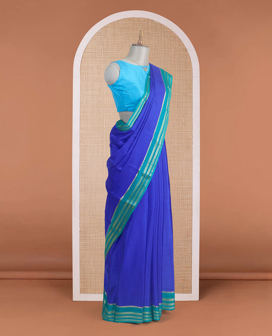 Blue plain design Mysore silk saree, contrast traditional rettai pettu border, and zari stripes pallu