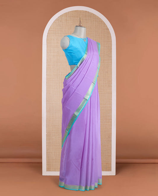 Light lavender plain Mysore silk saree, contrast traditional zari border, and zari striped pallu