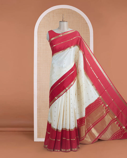 Cream zari buttas steeped Mysore silk saree, contrast rettai pettu traditional zari border, and pallu of temple design in golden zari