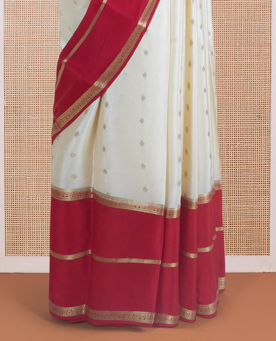 Cream zari buttas steeped Mysore silk saree, contrast rettai pettu traditional zari border, and pallu of temple design in golden zari