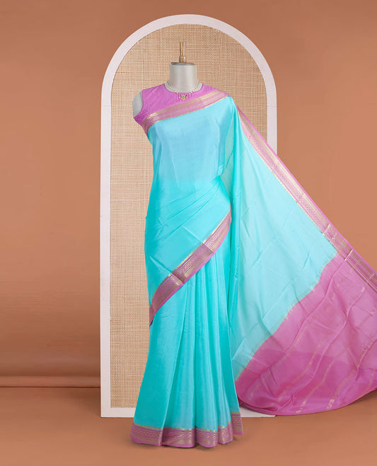 Light blue plain Mysore silk saree, contrast traditional zari motifs woven pink border, and zari striped pallu