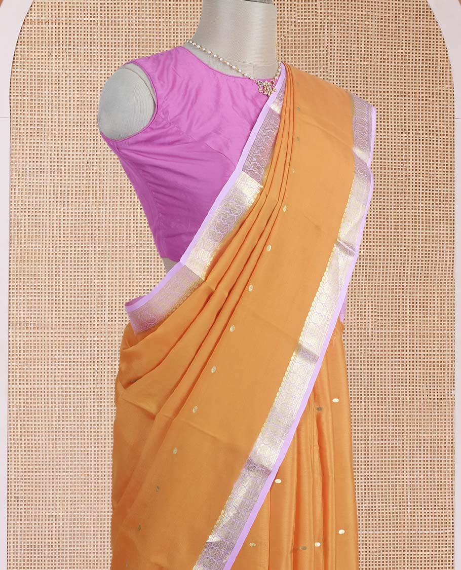 Orange zari buttas steeped Mysore silk saree, contrast traditional zari border, and pallu of zari stripes