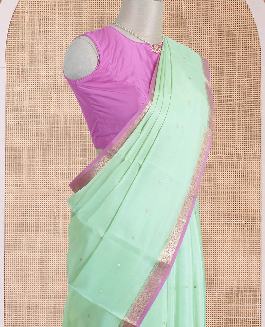 Light pista green zari buttas Mysore silk saree, contrast floral creeper zari border, and zari striped pallu