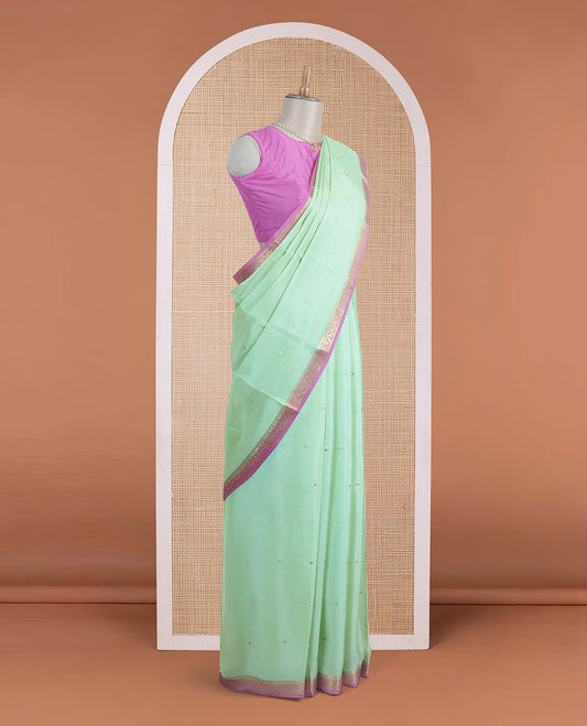 Light pista green zari buttas Mysore silk saree, contrast floral creeper zari border, and zari striped pallu