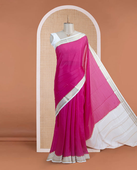 Dark pink plain body Mysore silk saree, contrast border adorned with traditional motifs in zari, and pallu of zari stripes