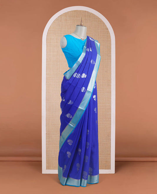 Blue floral zari buttas steeped Mysore silk saree, contrast temple zari border, and scallop zari design pallu