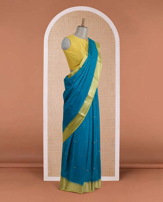 Green zari buttas Mysore silk saree, contrast jaal zari border, and floral jaal design zari woven pallu