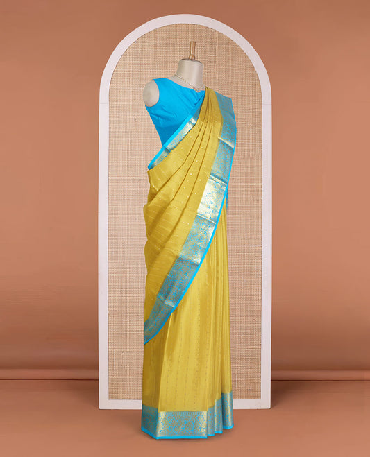Yellow zari buttas Mysore silk saree, contrast floral zari border, and intricate pallu