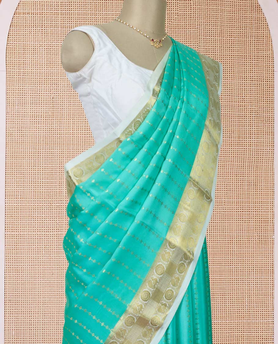 Turquoise zari buttas Mysore silk saree, contrast peacock and chakram zari border, and pallu steeped with traditional zari designs