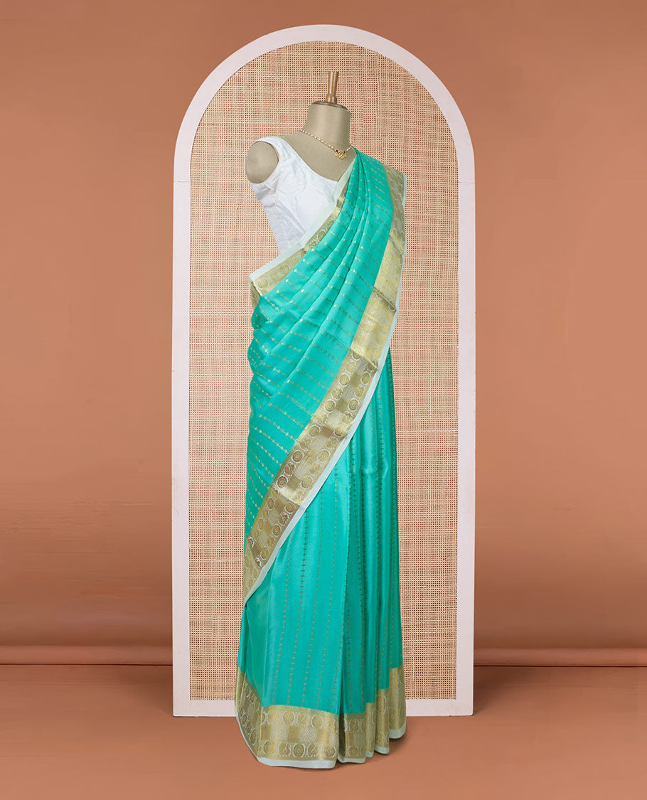 Turquoise zari buttas Mysore silk saree, contrast peacock and chakram zari border, and pallu steeped with traditional zari designs