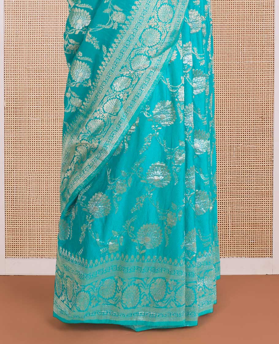 Green floral jaal jacquard fancy crepe saree, floral creeper zari border, and pallu of paisley jaal design
