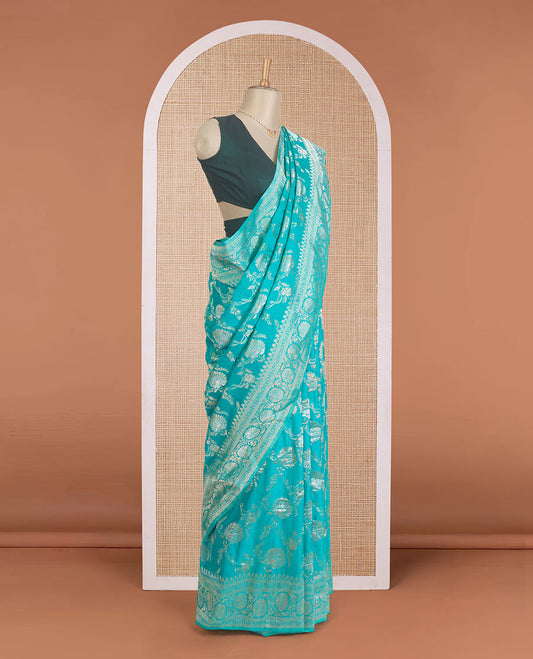 Green floral jaal jacquard fancy crepe saree, floral creeper zari border, and pallu of paisley jaal design