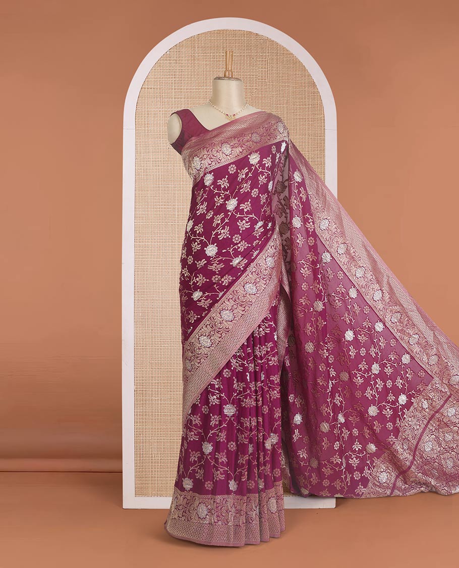 Maroon floral jaal jacquard fancy crepe saree, floral creeper zari border, and pallu of floral jaal design