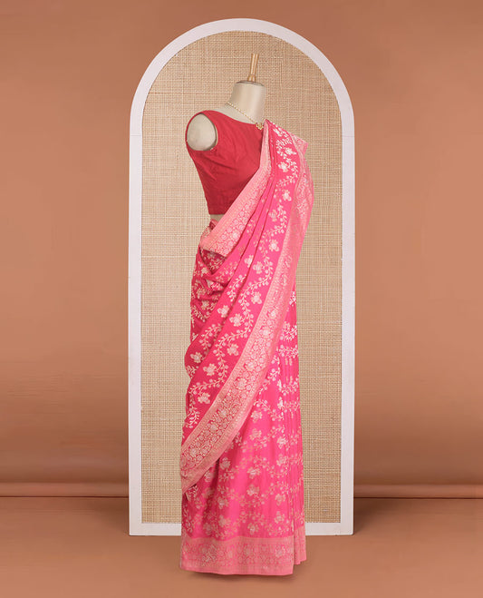 Fushcia pink floral jaal jacquard fancy crepe saree, floral creeper zari border, and pallu of floral jaal design