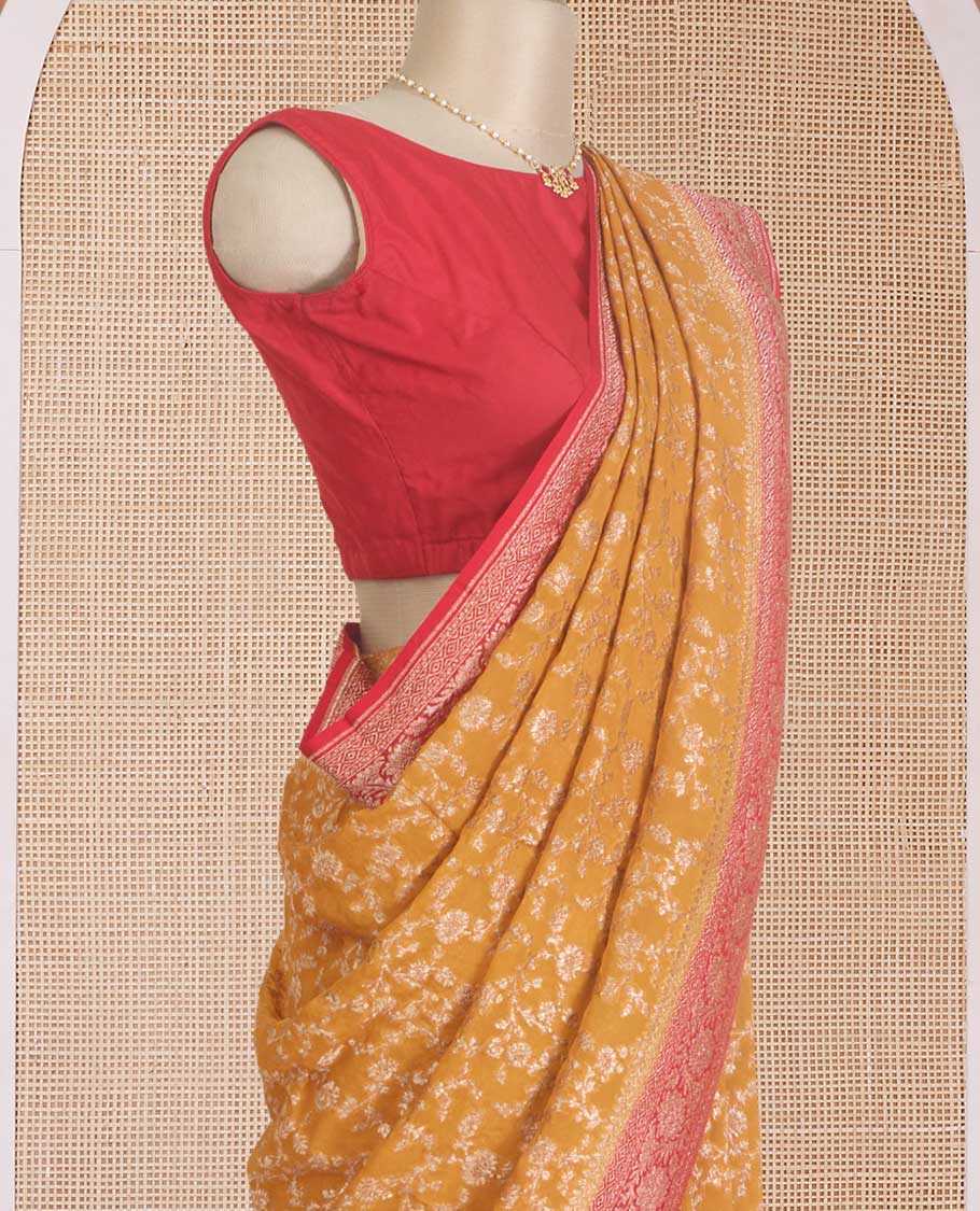 Yellow floral jaal jacquard banarasi georgette saree, contrast floral creeper zari border, and pallu of floral jaal design