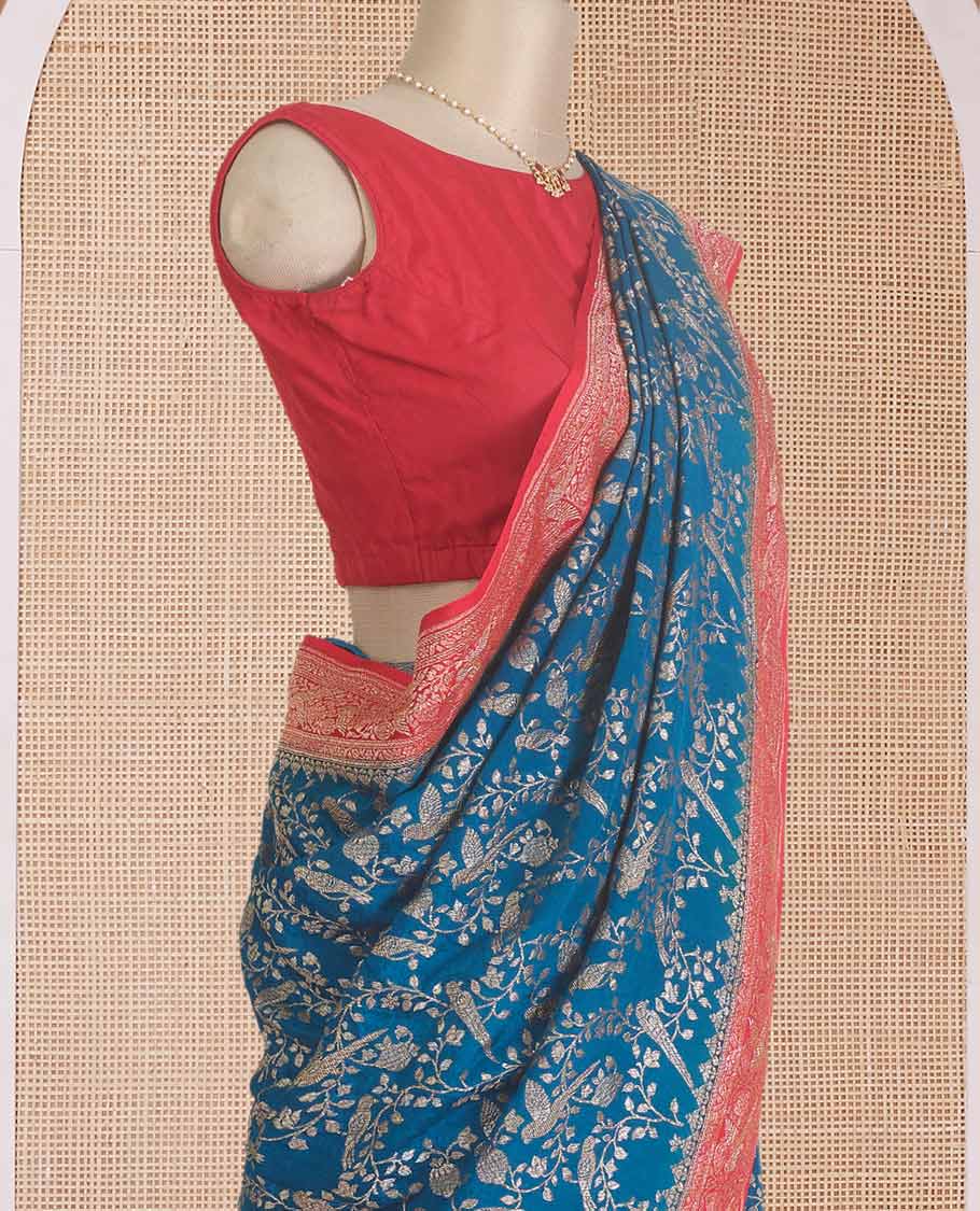 Blue floral and bird jaal jacquard banaras crepe saree, contrast floral and bird jaal zari border, and pallu of Mughal style motifs
