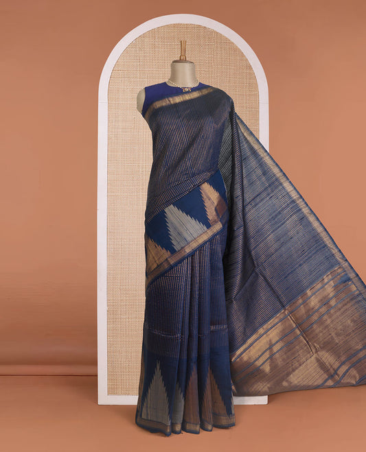 Blue dobby-style buttas dupion silk saree, big thazampoo rekku border, and zari-rich pallu