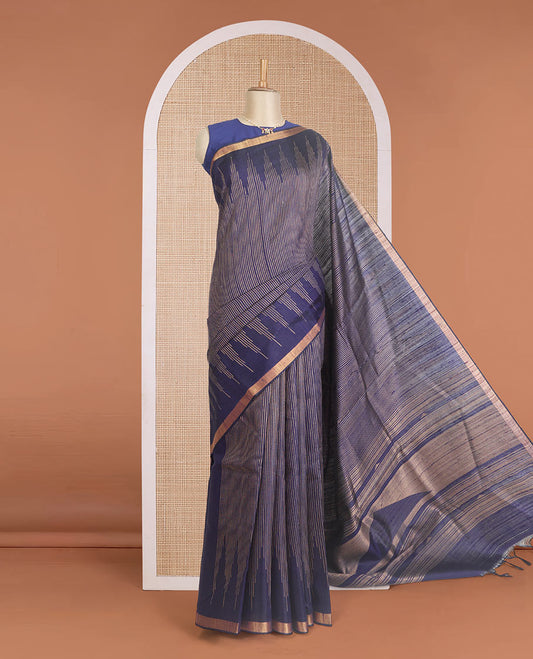 Blue striped dupion silk saree, big thazampoo rekku zari border, and zari-rich pallu